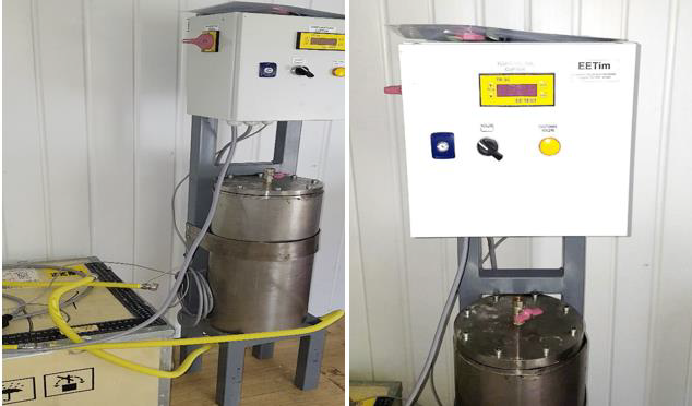 A machine with a white box and a yellow tube  Description automatically generated with medium confidence